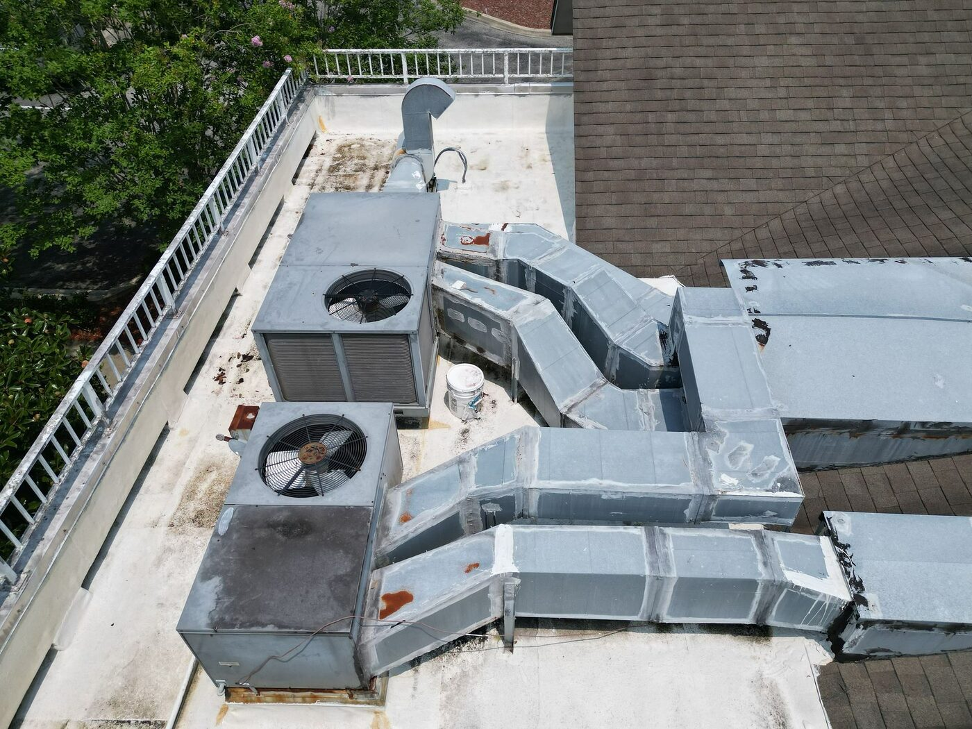 Roofing at a mechanical area where perimeter and equipment details required review.