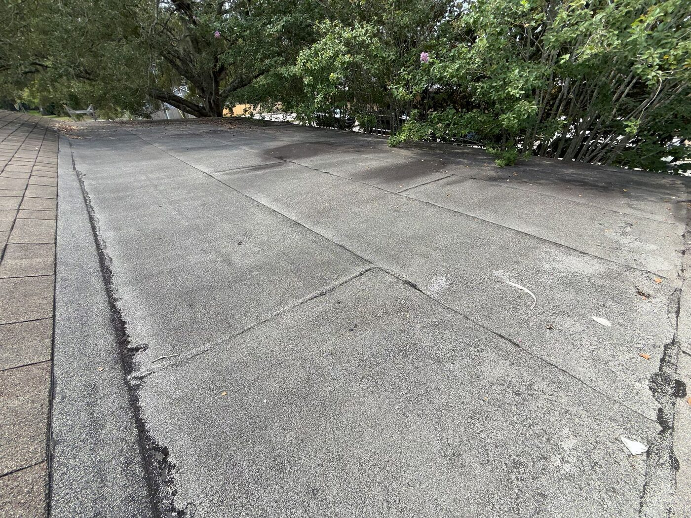 A worn low-slope membrane surface documented during the campus assessment.