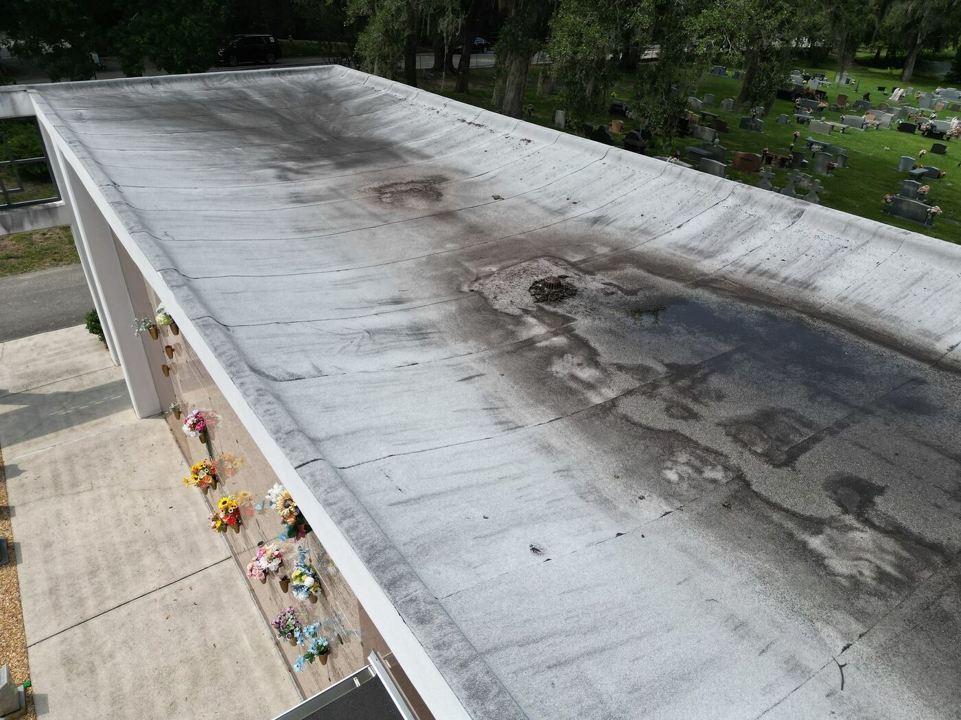 A low-slope roof section where multiple seams and transitions were assessed.