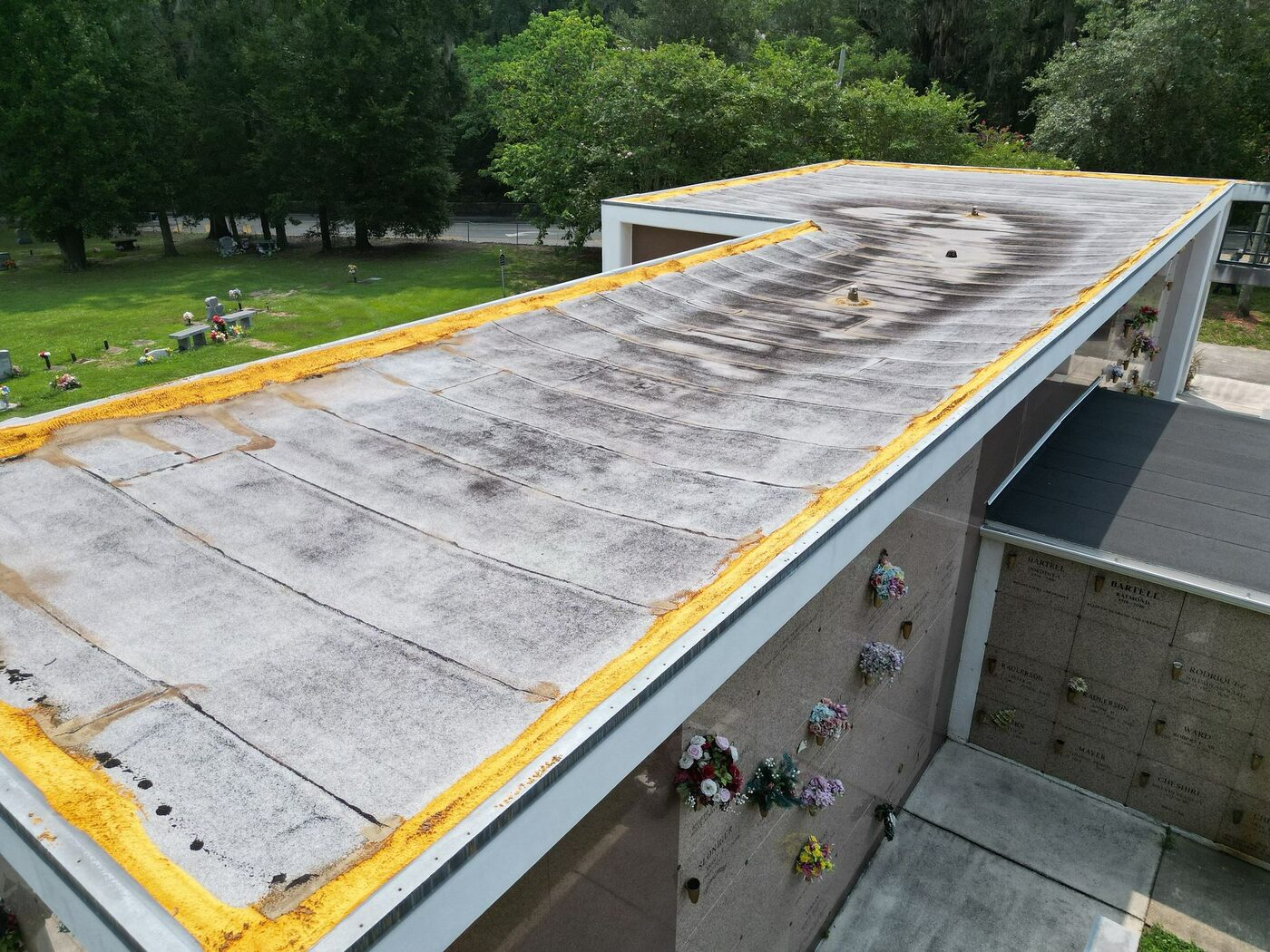 A broad elevated view of a weathered roof area on the campus.