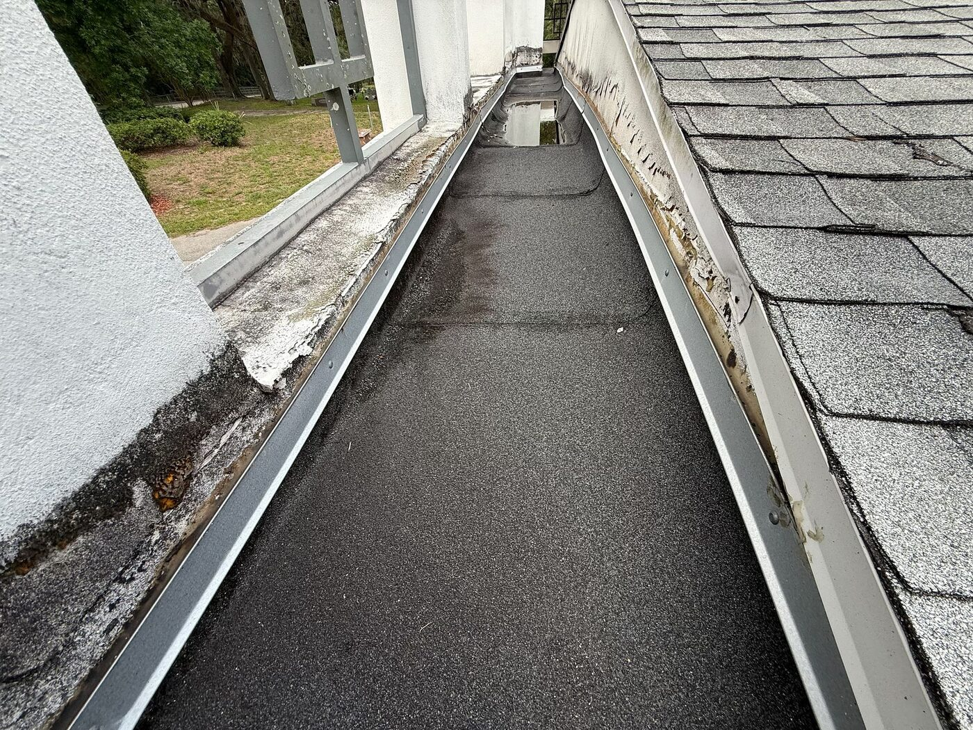 A roof-edge channel that needed attention as part of the campus-wide scope.